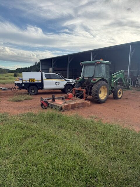 Tractor and implement on a farm with Yates Group ute