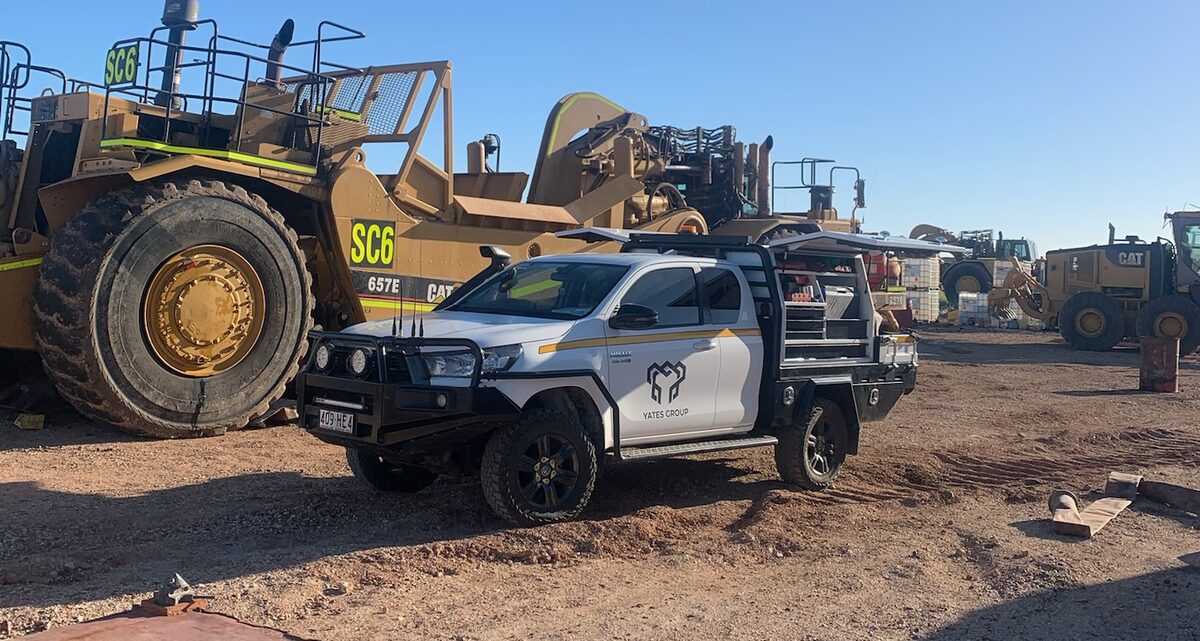 CAT 657 tractor-scraper with Yates Group ute on site