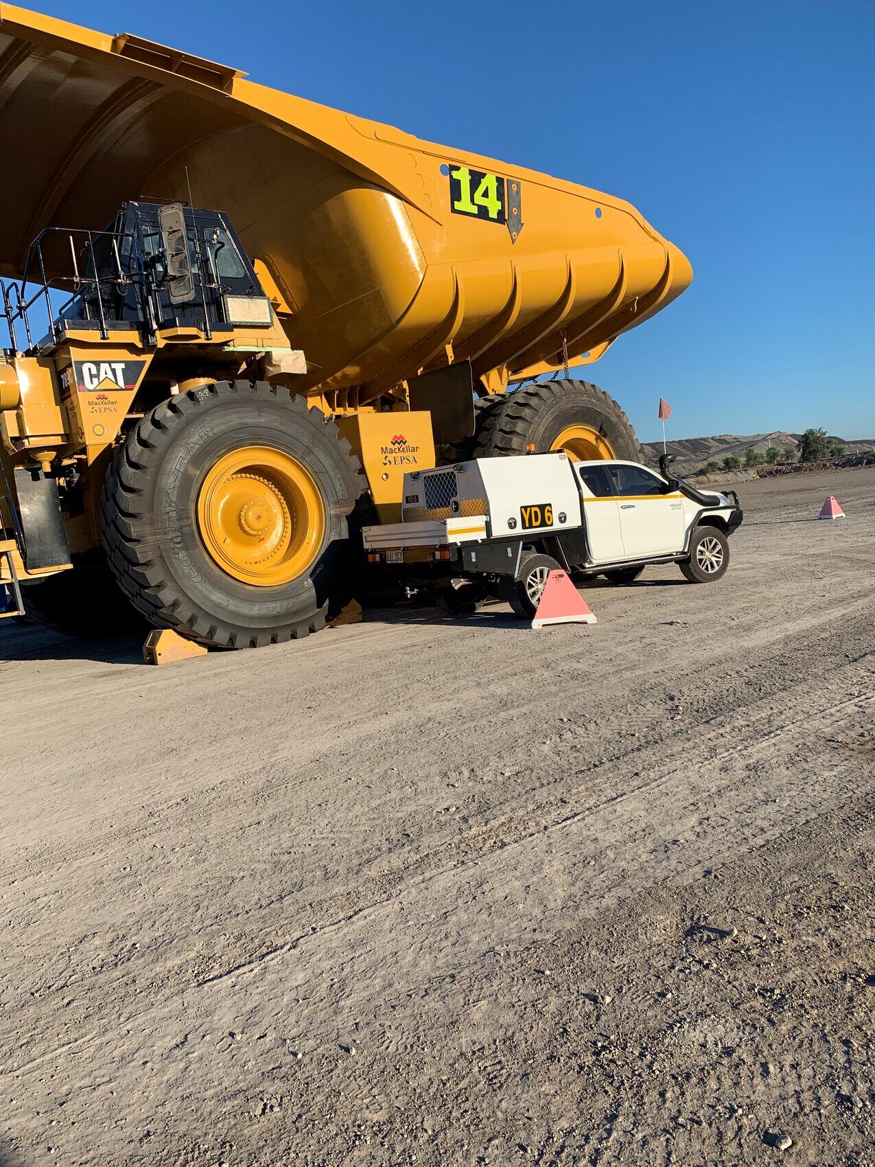 Large Cat haul truck with Yates Group ute
